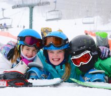 Happy kids take a break in the snow at Seven Springs Mountain Resort. Photo courtesy of Seven Springs