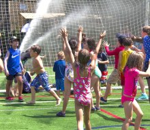 Stay cool with Asphalt Green on July 27 for free Sprinkler Day! Photo courtesy of Asphalt Green