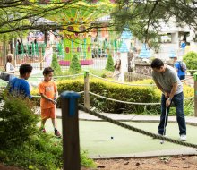 Enjoy some quality family time at the Castle Fun Center's mini-golf course.