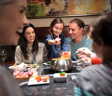 Families can gather around the fondue at the Melting Pot. 