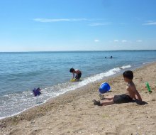 Kids wait for the tide to go out for critter catching at Hammonasset Beach State Park.  