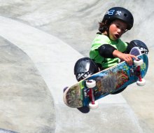 Kid catching air at Venice skate park. Photo by Maxium Pandacc