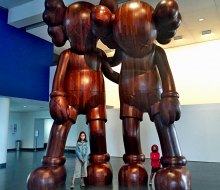Strike a pose with the giant KAWS sculptures at the Brooklyn Museum. 