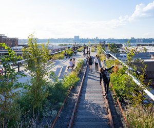 Kids can walk along exposed tracks during a visit to the High Line