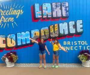 Photo of kids posing in front of Like Compounce sign