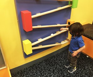 DuPage Children's Museum: balls rolling on wooden wall track
