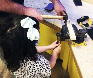 DuPage Children's Museum: girl woodworking