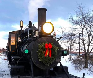 10 steam train coaches are decorated for Christmas, ready to whisk kids away to watch Santa as he prepares his sleigh. Photo courtesy of the Maine Narrow Gauge Railroad