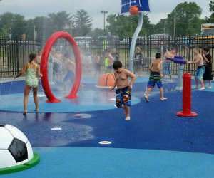 Sprinkler Parks and Splash Pads in New Jersey: Kids run through water at Manalapan splash pad 