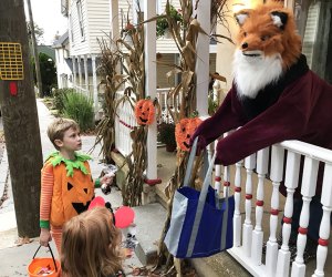 A fox hands out candy to trick-or-treaters in Pitman. Photo by Lisa Warden