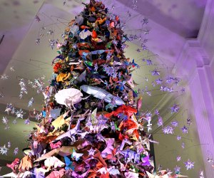 The American Museum of Natural History's annual origami tree overflows with buggy inhabitants in 2022. Photo by Jody Mercier