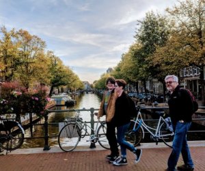 Stroll past Amsterdam's pretty canals on a family vacation to the Dutch city
