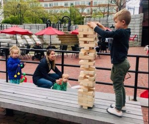 Boston Breweries: Image of family enjoying outdoor space at a Boston beer garden in Charlestown.