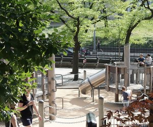 View of Ancient Playground through the foliage in Central Park