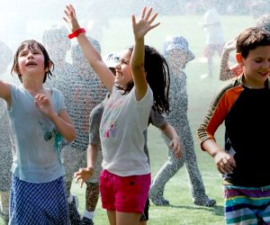 Head to Asphalt Green's Upper East Side location for an afternoon of wet and wild fun on Sprinkler Day. Photo courtesy of Asphalt Green