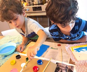 Indoor activities on Long Island two kids boys painting at a kitchen table