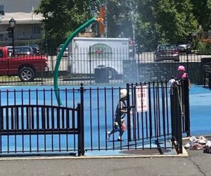 Kids run through the sprinkler park at Barnhardt Park in Sleepy Hollow