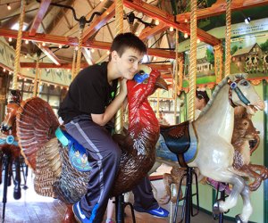 Ride on the carousel during a visit to Bear Mountain State Park with kids.