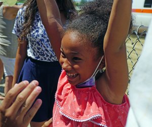 Belmont Park, NY: Girl celebrating a horse race