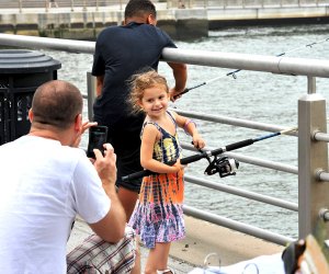 Adults and kids ages 5+ learn how to fish with environmental educators at Big City Fishing Sunday, all gear provided! Photo courtesy Hudson River Park