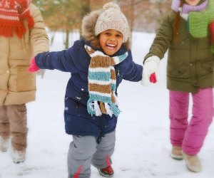 Playing in the snow is a favorite thing to do for kids in Boston during winter. Photo via Bigstock
