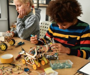 Photo of a smile doing STEM winter activities at a table.