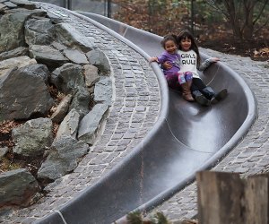 Two girls on granite slide at Billy Johnson Playground in Central Park