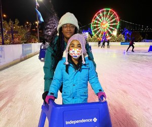 Skate next to the Ferris wheel at Blue Cross RiverRink WinterFest. Photo by Danielle Smith