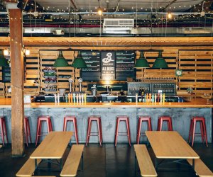 indoor beer garden with tables and a bar