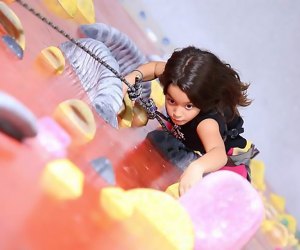 The climbing wall at the Brooklyn Bouldering Project challenges kids to climb to new heights. Photo courtesy of the venue