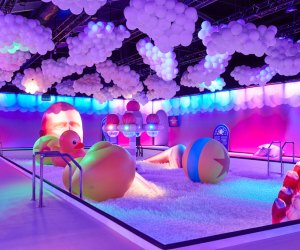 Jump into a giant bubble-bath ball pit at Bubble Planet: An Immersive Experience. Photos by Quentin Guyot for Fever Productions