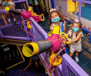 two girls shoot a bubble blaster