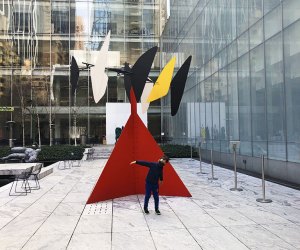 Boy in front of 'Butterfly' in the garden at MOMA