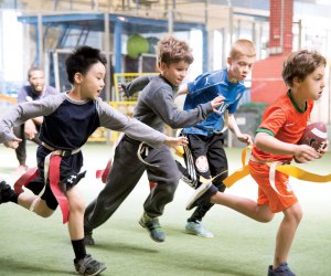 In addition to the wide variety of sports classes including baseball, basketball, soccer, and Parkour, the Field House at Chelsea Piers offers a flag football program for children ages 7 – 10 that consists of skill development and game play. Photo by Scott McDermott