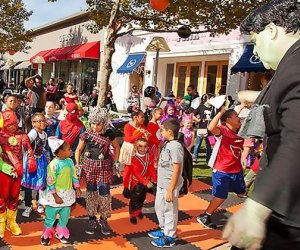The Cross County Shopping Center's annual Halloween bash features a lively blend of dancing, bouncing, crafting, stories, games, trick-or-treating, and more. Photo courtesy of the event
