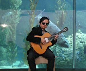 Enjoy the creative talent of Dat Nguyen on guitar. Photo courtesy of the Aquarium of the Pacific