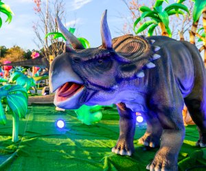 LuminoCity Dino Safari is the world's only immersive experience blending light art with life-sized, roaring dinosaurs. Photo courtesy of the event