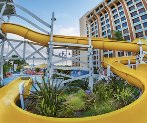 Twsit, turn, then plunge into refreshing waters with a wild ride down the water slide at Disney Paradise Piers Hotel. 