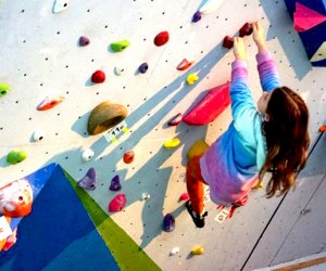 girl indoor rock climbing at Downingtown Rock Gym Indoor Kids' Birthday Party Places Near Philly