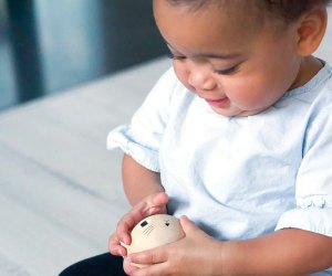 baby milestones include being able to play with toys