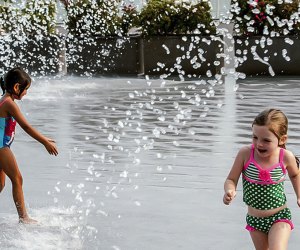 Enjoy the scenery on the Georgetown Waterfront while splashing in the fountain. Photo by Sam Kittner, courtesy of  georgetowndc.com