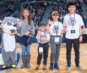 College sports in Connecticut put family fun front and center! Photo by Stephen Slade, courtesy of the University of Connecticut Athletics