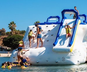 Best Swimming Spots to Host a Pool Party for Your Los Angeles Kid: Newport Dunes Resort Inflatable Water Park