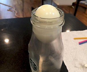 Watch as the egg slides into the bottle!