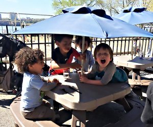 Kids get their own special outdoor dining tables at Ellington in the Park. Photo by Shira Kronzon.