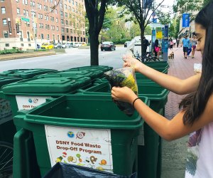 girl composting in a city compost bin 