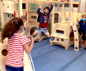 Conquer the monkey bars during a private play sessionat Exceptional Explorers