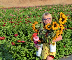 Flowers always bring smiles to little faces!