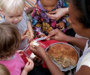 Kids gather around for snacks a the Broooklyn Forest nature preschool