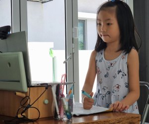 The Best Free Online Summer Camps for Kids in 2025 Girl at computer